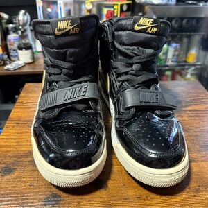 Jordan 312 Black and Gold High-Top Sneakers